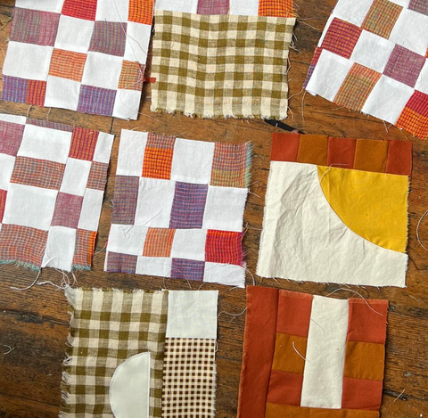 Collection of patchwork squares on a wooden surface